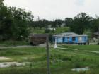 The Lower 9th Ward Levee. This photo date July 14 2007. All that remains is the white church steeple on this lot.