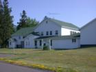 The LaPointe School building, behind the Madeline Island Historical Museum