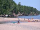 A beach like no other!  Vacationers enjoying the Lake Superior shore at the Town Park on Madeline Island