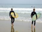 Surfing father and son