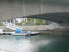 Boat slips are located along the canal.  Narrow quaint bridges such as this create a romantic European feeling in the area.