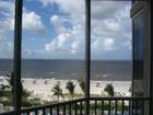 Ceiling to floor glass wall showcases the view of the Gulf.