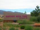 Sign for Manzano Mesa Park located in the SE part of Albuquerque. Just east of Eubank off of Southern. 