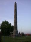 Stone obelisk in the Hinckley Cemetery which marks the common grave containing the remains of 248 men, women and children who perished in the Hinckley fire of 1894.
