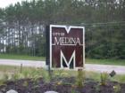 The City of Medina sign on County Road 24