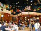 The Disney Store on Hollywood serves food and memorabilia.  Mickey's Special is 8 scoops of ice crea, one can of whipped cream, nuts, cherries, and Mickey's hat!  Yum!