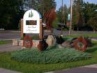 Metal sculptures in front of bank building, Cable, Wisconsin