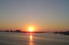A Sand Key sunset in the distance - waterfront luxury living.