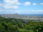 A view of downtown Honolulu from Tantalus Drive.  The volcanoe in the background is the world famous "Diamond Head".  Isn't it time for you to visit Hawaii?