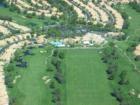 Aerial shot the Clubhouse and driving range.