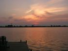 The sun is setting on Chestermere lake in July