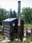 The wood boiler that heats the kiln at the Madeline Island sawmill