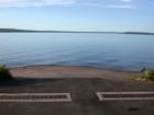 The blacktop road and concrete apron leading to the water's edge helps faciltate traffic on and off the ice road on the Madeline Island side. The Bayfield side is sand beach.