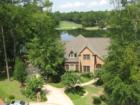 Home on the Lake with Signature 17th hole of Golden Eagle Golf Course in the background.