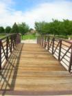 Bridge connecting CNM Montoya campus north parking lot with the park next to the community college. Located on Morris just north of Montgomery. 