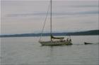 Looking west from Browns Point Lighthouse Park across the norther tip of Vashon Island, to the Kitsap Pennensula and the Olympic Mountains.
