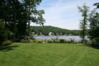 This lake front features a very private 1.5 acre level lot and more than 350' of frontage.
