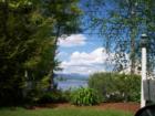 Lake and Mountains picking through the trees in Gilford