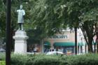 Statue of one of the statesmen of Marietta Alexander Stevens Clay with the ever popular Hemingway's bistro/bar/nightclub in the background.
