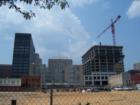 The RBC Plaza rises under the crane between Fayetteville Street and Wilmington Street on the south side of Martin Street. 540 feet tall with 192 luxurious condos, the plaza will be in the middle of "everything" in downtown Raleigh, NC.