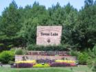 The sign on Towne Lake Hills Blvd welcoming you to Towne Lake