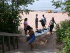 Kayak enthusiasts coming in off the beach at Meyers Beach, Apostle Islands National Lakeshore
