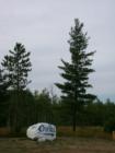 The "Oulu Rock" on Highway 2, just east of Brule, Wisconsin. Note the Finnish flag on the side of the rock.