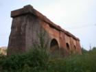 A relic of the late 1800s, this brownstone trestle arch support rests in the shadow of newer ore docking facilities in Superior, Wisconsin.