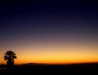 Sunset over Long Beach, San Pedro and Palos Verdes as seen from across the Bay at Huntington Beach