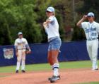 Sara Barfield, Rogers Team Buyer Specialist, throws out the first pitch at the last Carolina - Duke baseball game before the new baseball stadium is begun.