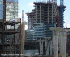 In this shot Vdara at MGM MIRAGE CityCenter sits on right while the monorail columns enter the retail section station behind Veer Towers (left)