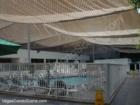 Under the net that has been installed over the Jockey Club pool area to protect swimmers during construction of The Cosmopolitan Resort Casino.  August 2007