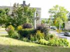 Bell Canada Building on Bridge Street, St. Thomas Anglican Church Garden and Cross in the foreground