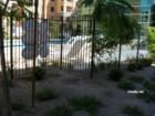 This is part of the pool area at the Manhattan condo community. The pool extends around the building.