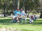 Old trees provide shade and conversation for golfers.