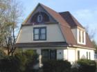 An old Dutch Colonial style home in the C. B. Campbell Resubdivision located in Grant Park Illinois.