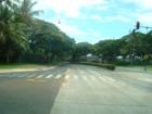 The entrance to the Westloch neighborhood in Ewa Beach is lined with trees and is situated very near to the entrance/exit to the H1 highway.