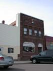 The historic Iron River Bank building is part of the area's brownstone construction legacy.