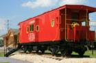 The Tomball Depot is located one block south of Main Street on Elm St. close to the tracks.   An exterior deck surrounds the Depot and a restored caboose from the Depot's era resides beside the Depot.