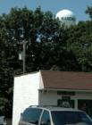 The water tower overlooks the community's grocery store.