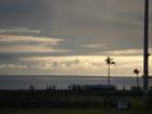 Mililani HS Marching Band with the ocean behind them, by Waianae HS stadium.
