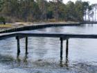 Phase I community dock into Choctawhatchee Bay.  Homeowners Association will restore the dock and build out a picnic area when is clear title to property is obtained.