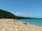 Waimea Bay.  The rock formation in the background is a favorite place for the daring to jump into Waimea Bay.  Hint: Do not jump in during low tide when the waves are receeding back out to the ocean.