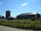 The Milwaukee Gas and Light Building, located in the Menomonee Valley, looks a lot like a railroad depot.  In fact, the tower was used as part of the gasification process. 