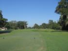 10th tee and fairway of Pine Forest CC at Tahitian Village with homes just off the course