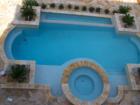view of the pool from up stairs