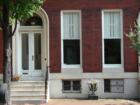 Front door with archway on classic style rowhome in Bolton Hill neighborhood