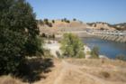 Dam and hillside at Sac State Aquatic Center, on Sacramento River at Highway 50 and Hazel, as seen from the trail.
