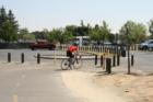 Biker enjoying the many miles of bike trail along the Folsom Lake bike trail accessible from Sac State Aquatic Center.