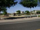 Park with covered playground and basketball courts.